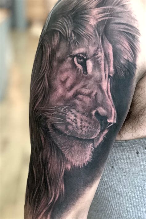 black and grey lion tattoo